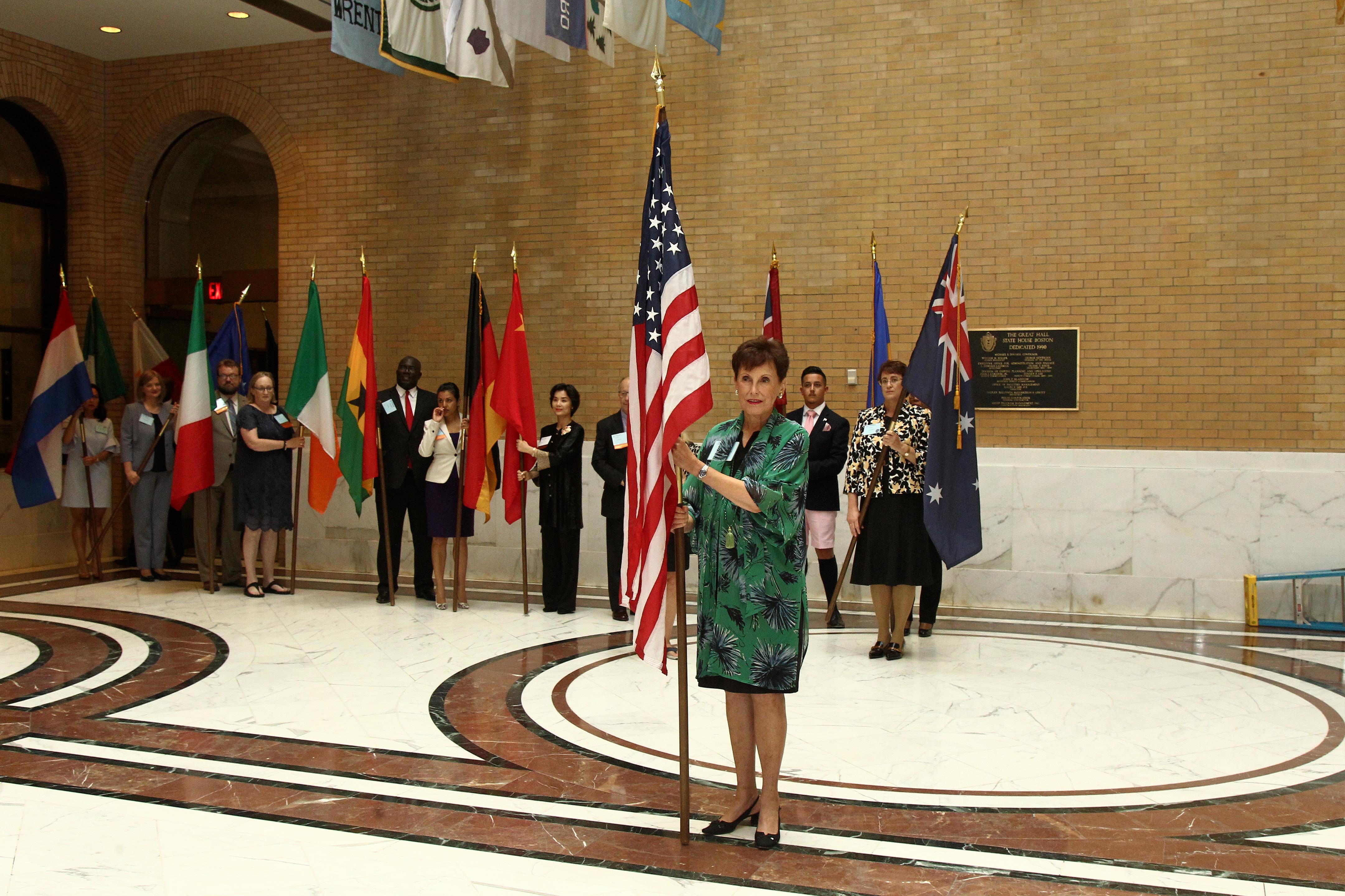 Ginger Barnard leading flag procession at Forum